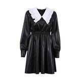 black faux leather dress with a white ruffled collar and cinched waist