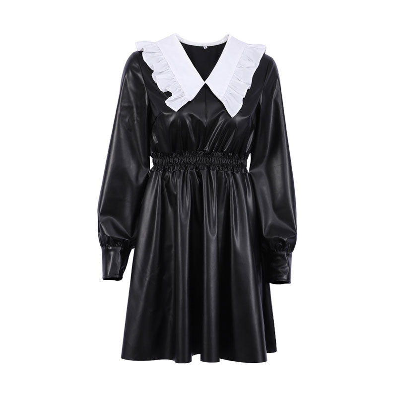 black faux leather dress with a white ruffled collar and cinched waist