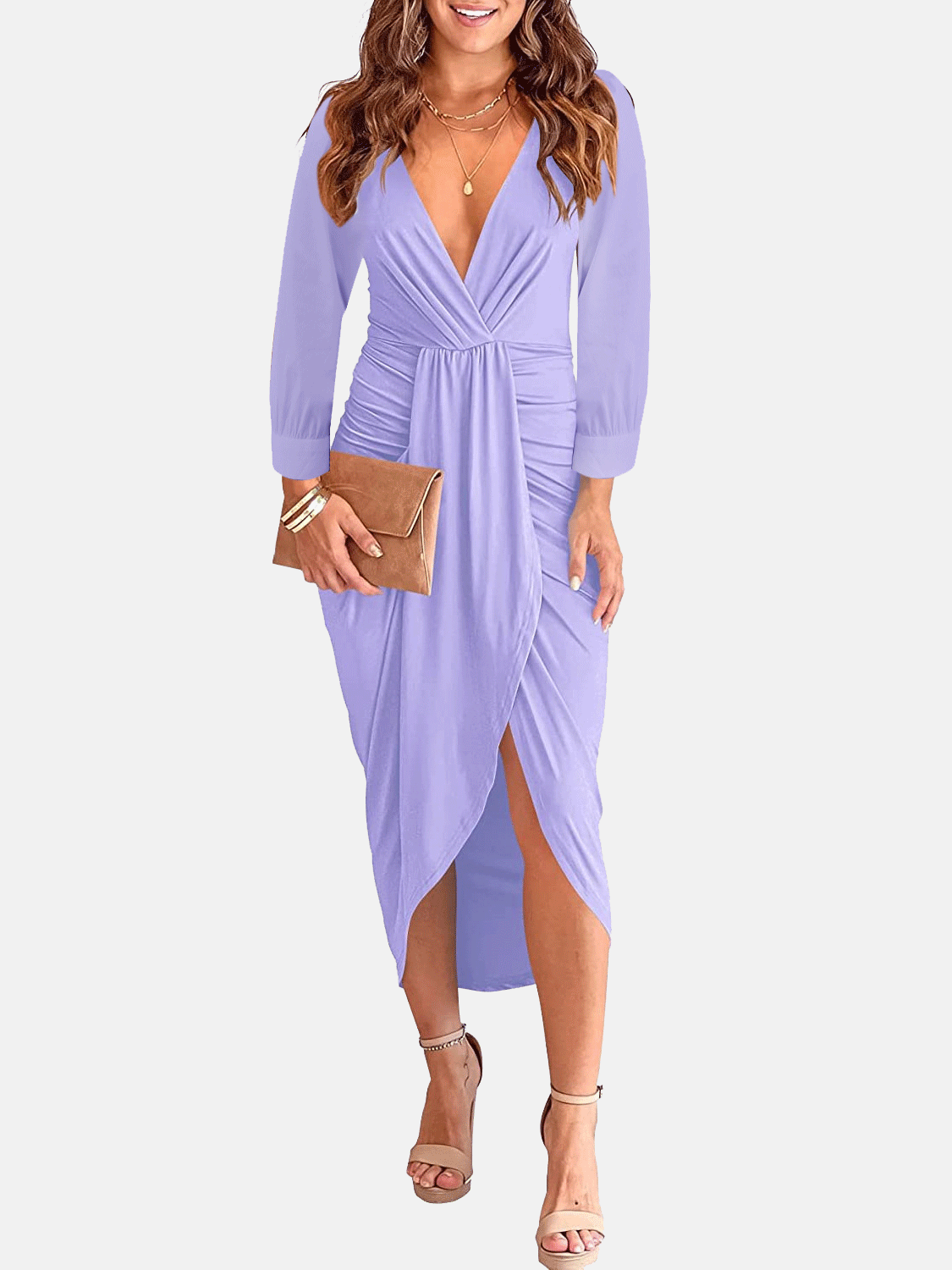 Woman wearing a lavender long-sleeve V-neck ruched waist dress with an asymmetrical hem and a clutch bag.