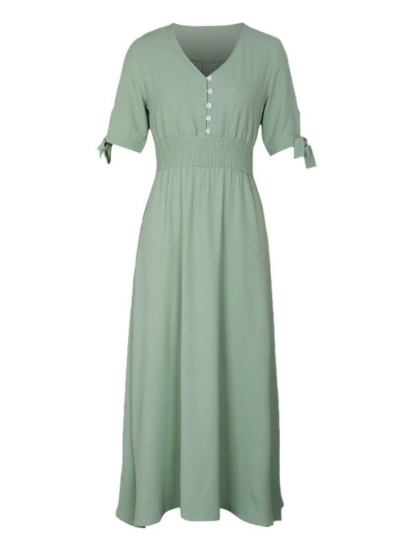 Sage green A-line maxi dress with smocked waist and tie sleeves, displayed on a white background.