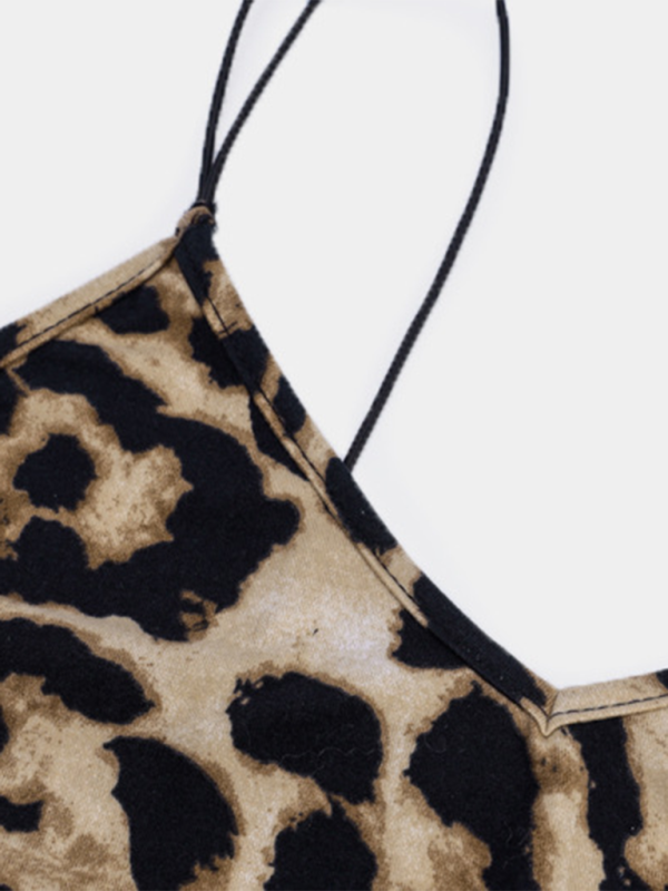 Close-up of the leopard print fabric and spaghetti strap detail on a dress