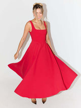 woman in red fit and flare midi dress with square neckline