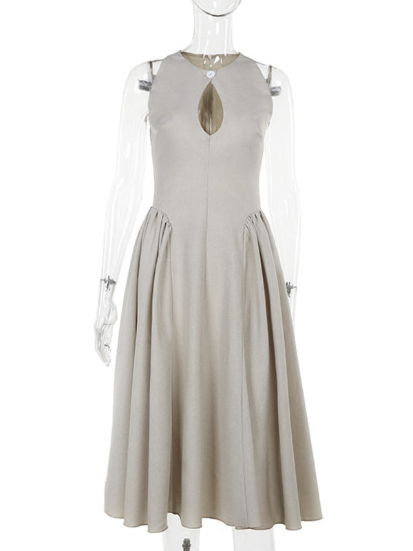 Mannequin displaying a beige sleeveless A-line dress with a keyhole neckline and a pleated skirt.