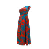 Close-up of the teal and red tropical print on the shoulder of the dress.