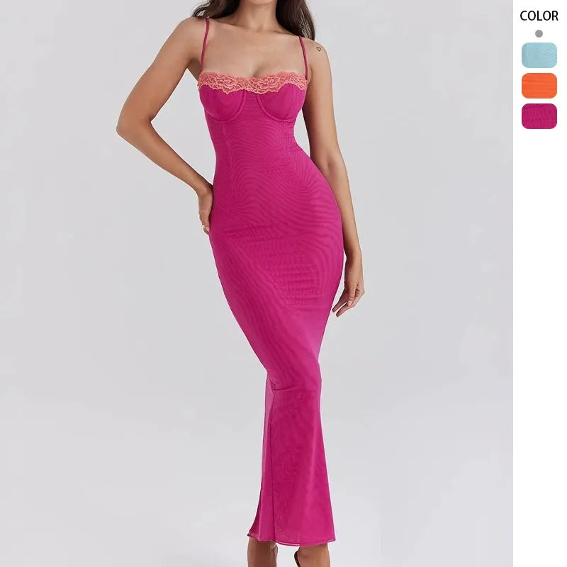 woman wearing a long fuchsia ribbed knit dress with lace trim