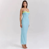 woman wearing a long light blue ribbed knit dress with lace trim