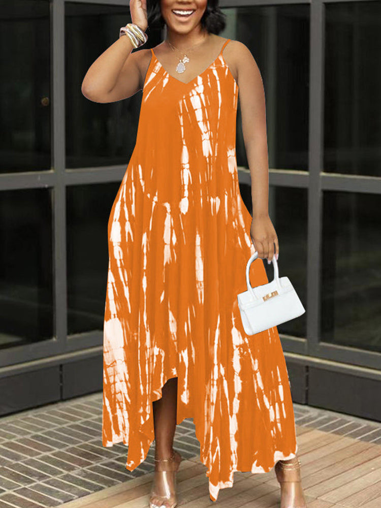 Woman wearing an orange and white tie-dye maxi dress with spaghetti straps and a v-neckline.