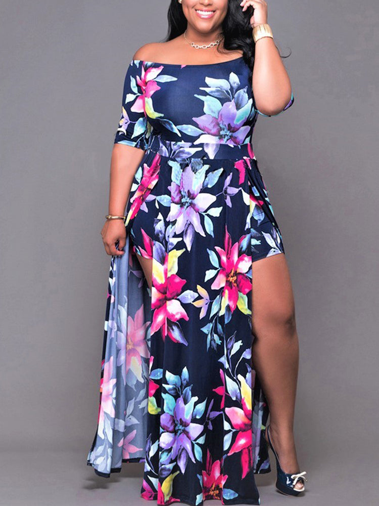 Front view of a woman in a navy blue floral print off-the-shoulder maxi dress with a high leg slit.