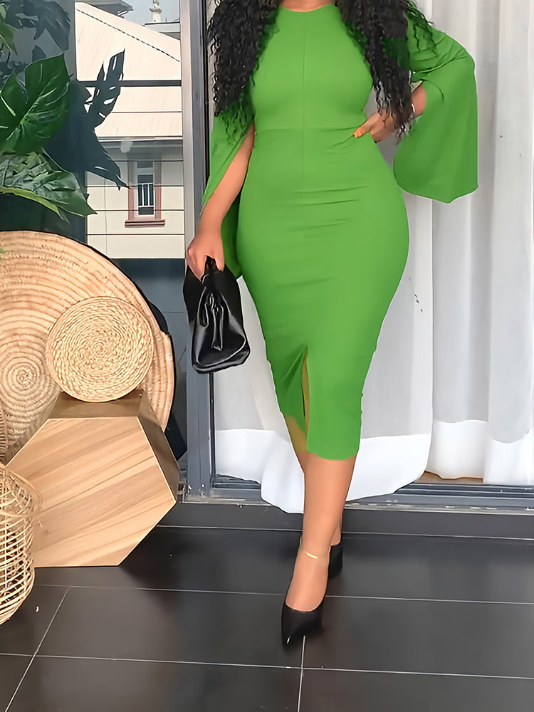 Woman wearing a lime green sheath dress with cape sleeves and a slit hem.