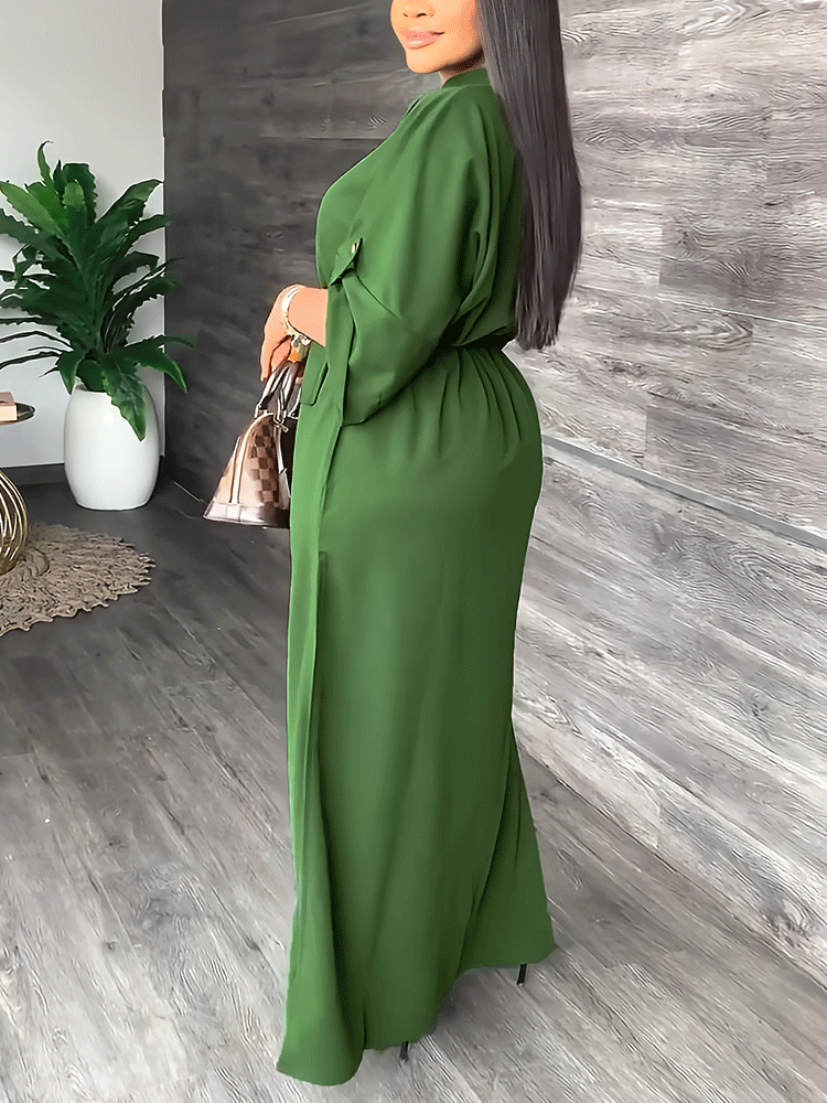 Side view of a woman in a green maxi dress, highlighting the silhouette and fabric drape.