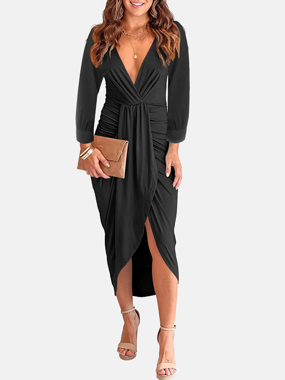 Woman wearing a black long-sleeve V-neck ruched waist dress with an asymmetrical hem and a clutch bag.