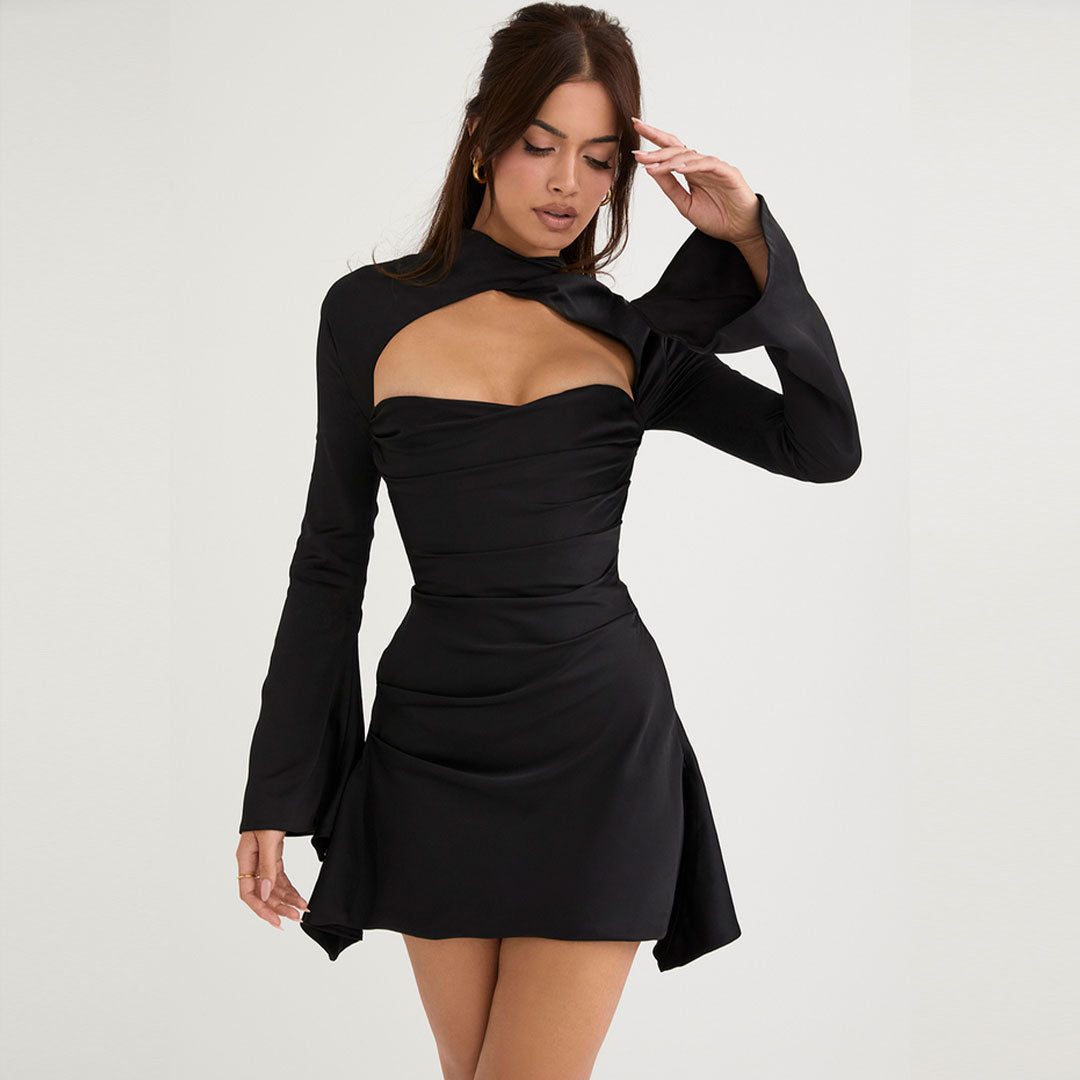 Model wearing a black long-sleeved mini dress with a high neckline and chest cutout.