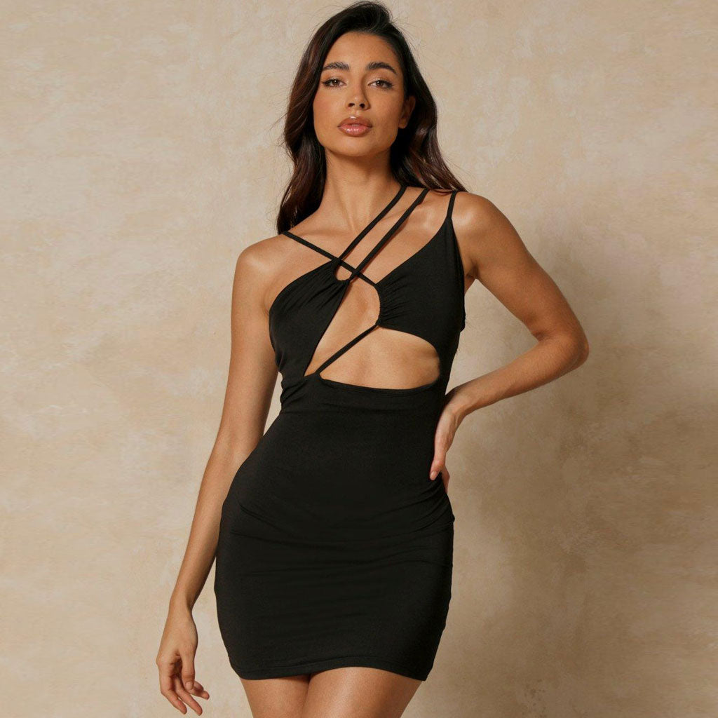 Model wearing a black ribbed knit mini dress with cut-out details and asymmetrical neckline
