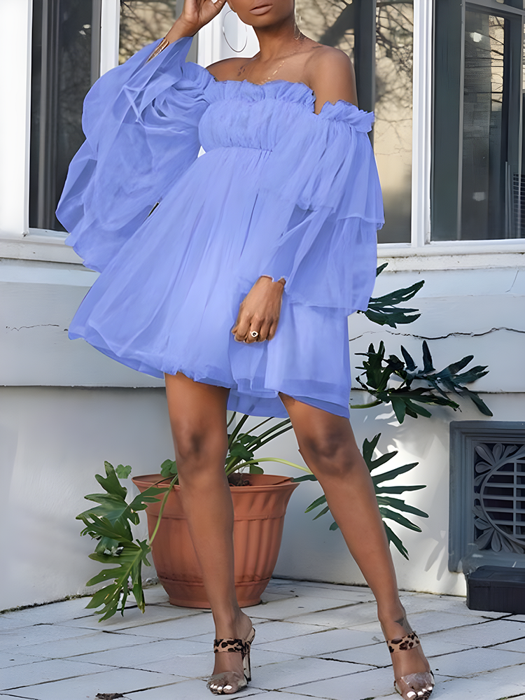 woman wearing an off-the-shoulder lavender tulle dress with tiered bell sleeves
