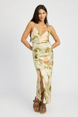 woman wearing a tie-dye slip dress with a v-neck and spaghetti straps