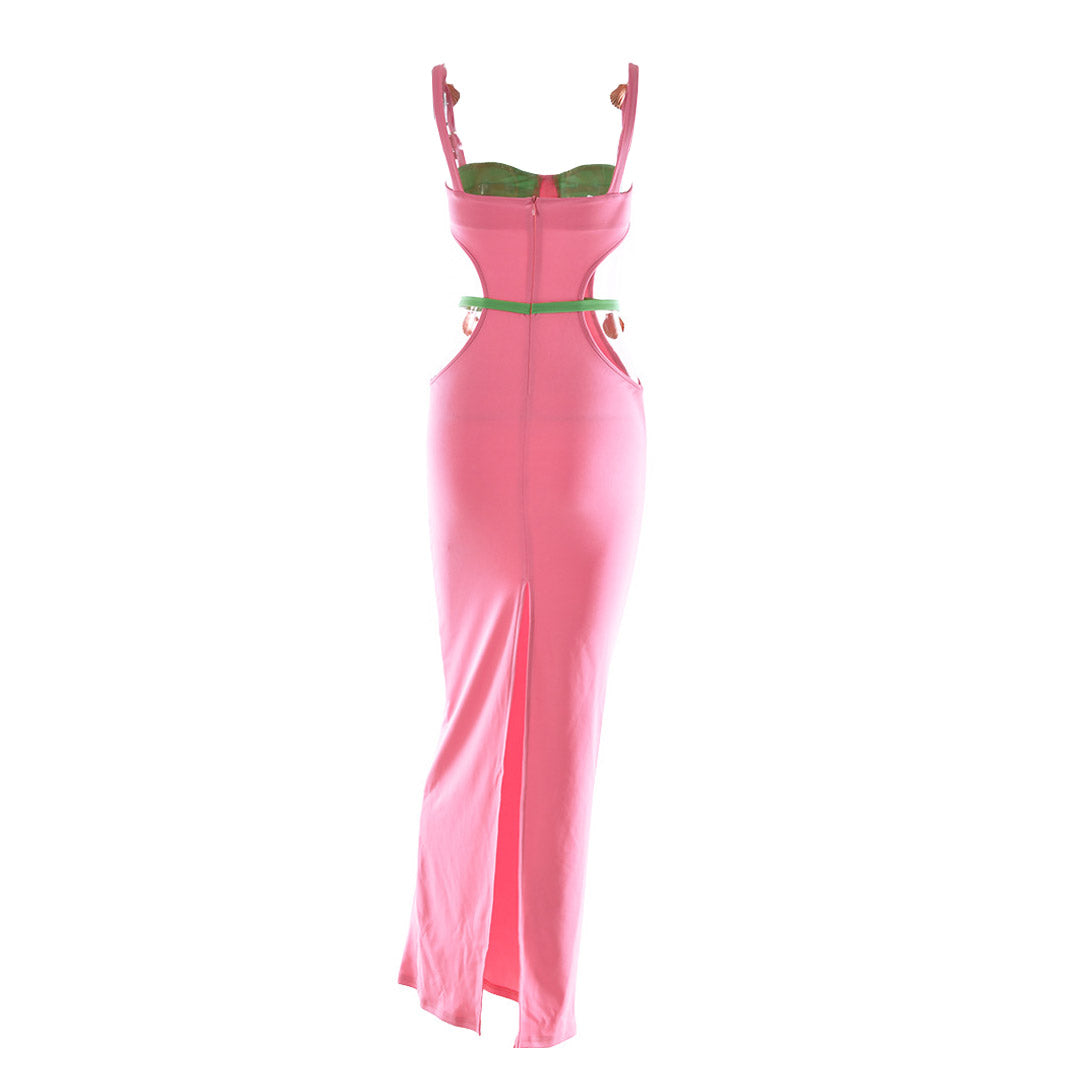 Back view of a pink and green maxi dress with a high slit