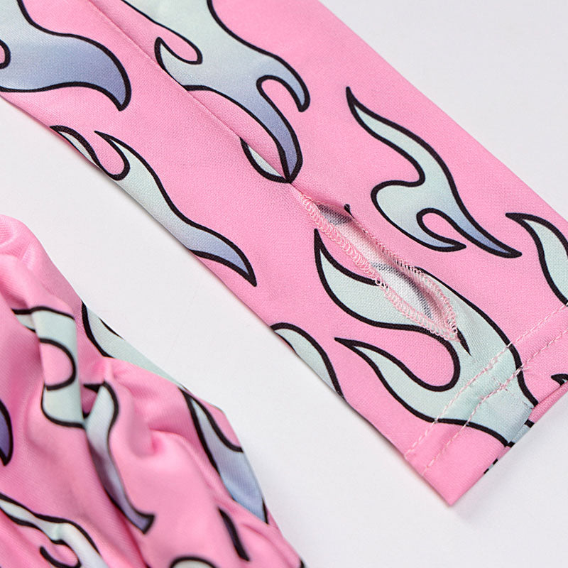 Close-up of the sleeve detail on a pink flame print dress