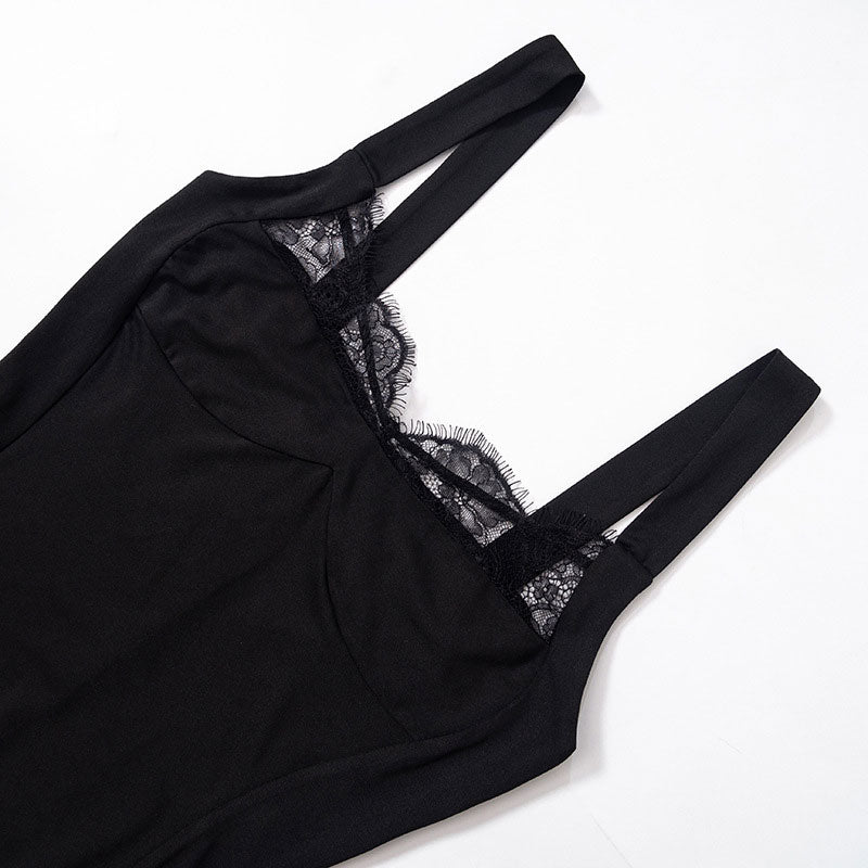 close-up of the lace neckline and straps of a black slip dress