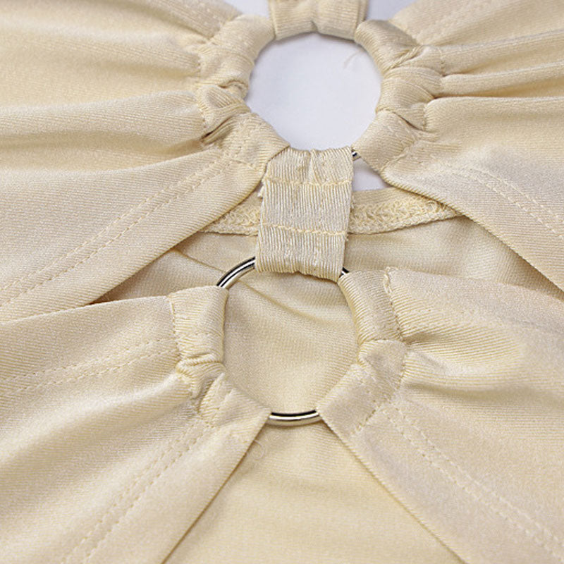 Close-up of the ring hardware and cut-out detail on the cream colored top.
