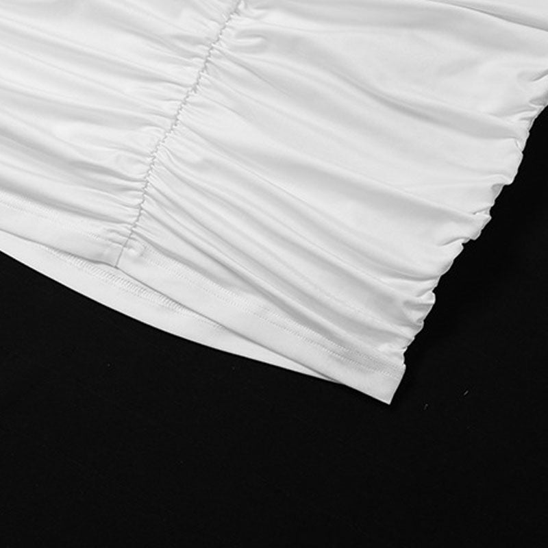 close-up of the ruched fabric detail on a white garment