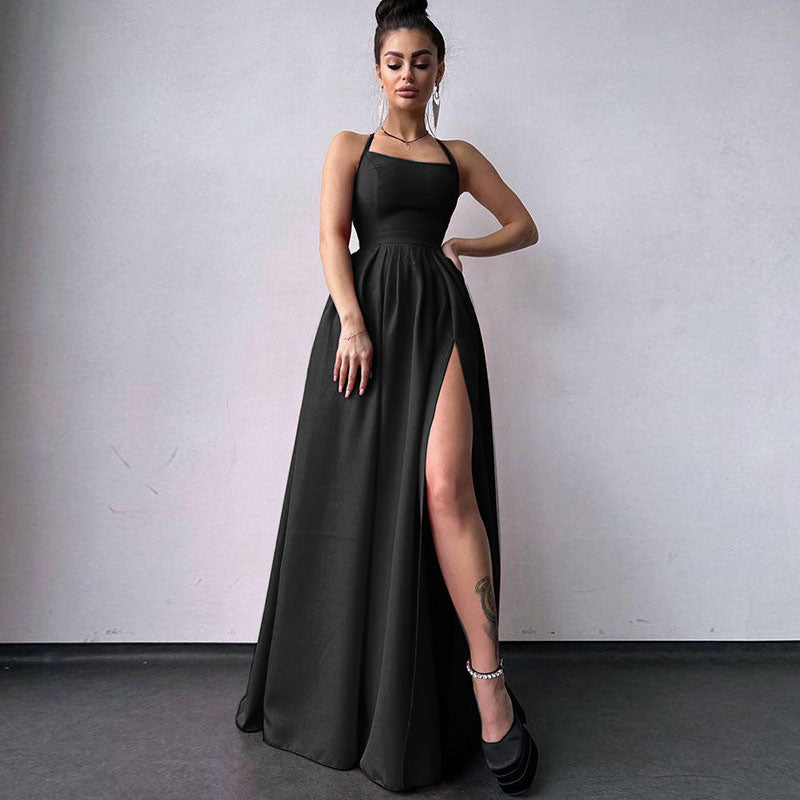 Full-length view of a woman wearing a black satin formal gown