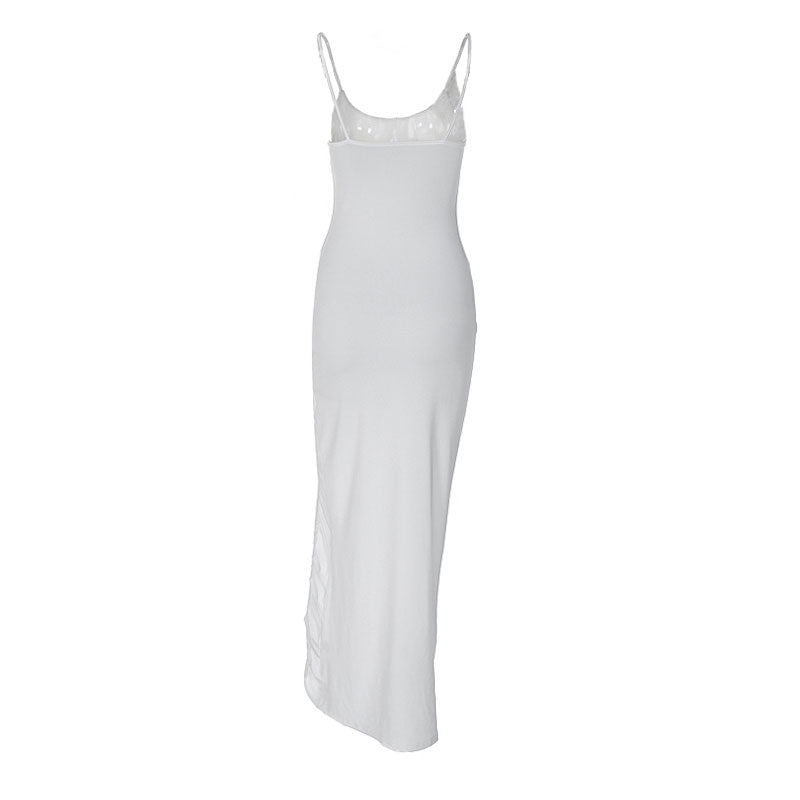 Back view of a white spaghetti strap maxi dress with a flowing hemline