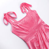 Detail of a pink satin dress showing the sweetheart neckline and tie shoulder straps.