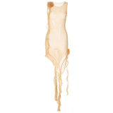 a sheer beige sleeveless dress with floral embellishments and ruffled trim