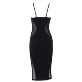 Back view of a black midi dress with sheer mesh side inserts.