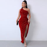 Woman in a red sequined one-shoulder maxi dress with a high slit, holding a clutch.