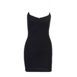 front view of a black mini dress with white spaghetti straps and side trim