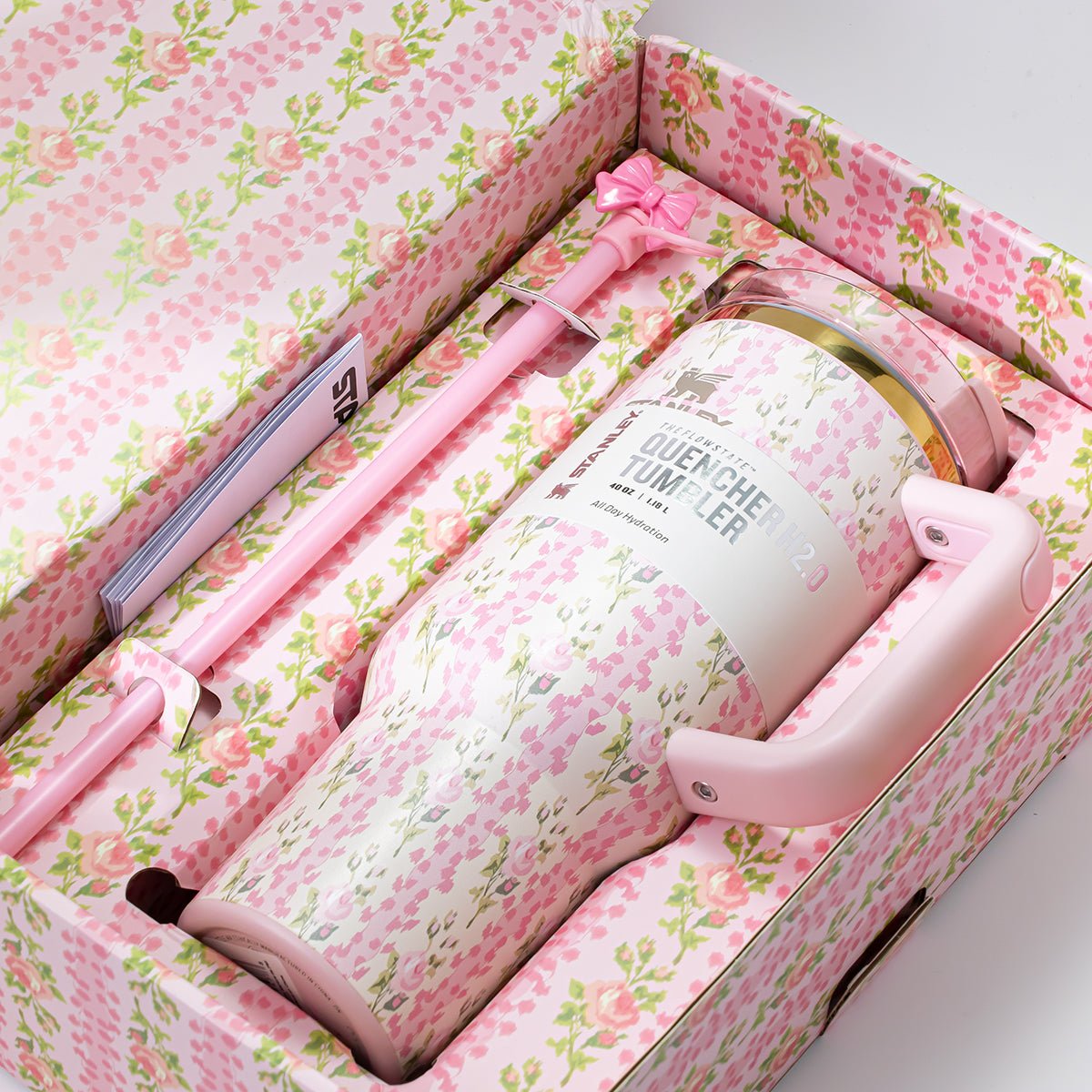 Close-up of Stanley x LoveShackFancy Quencher H2.0 FlowState Tumbler inside its gift box, pink floral print