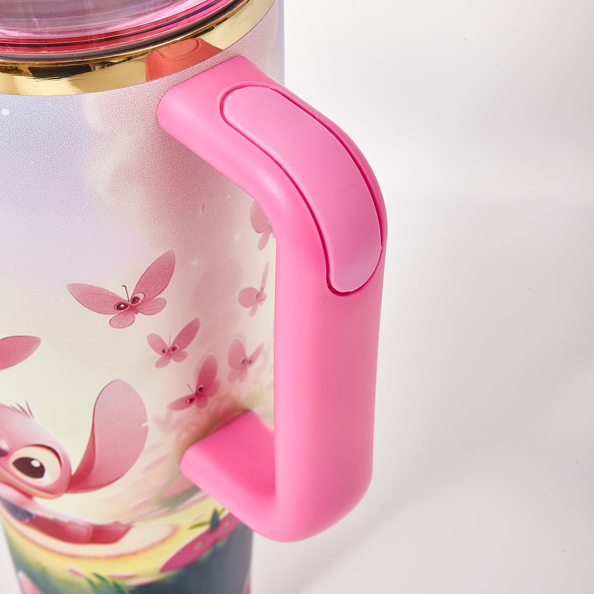 Close-up of the pink handle on the Stanley travel tumbler