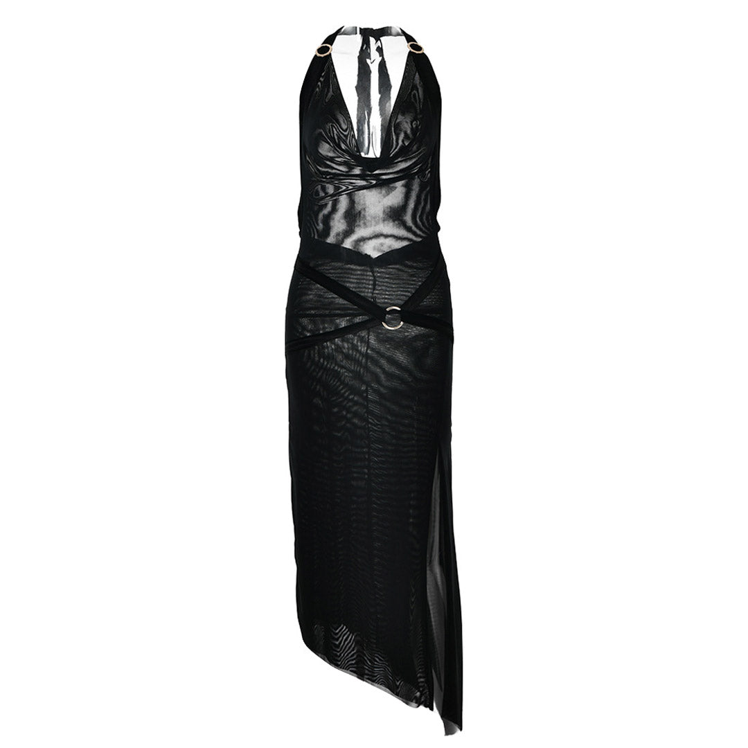A black halter neck maxi dress with a sheer mesh overlay, velvet trim, metal rings, and a high slit, displayed flat.