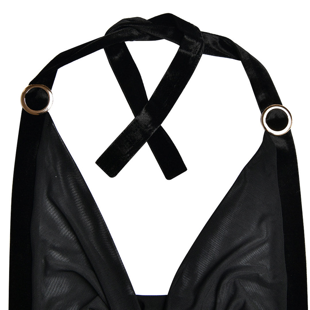 Detail of the velvet halter straps and metal rings on a black sheer mesh dress.