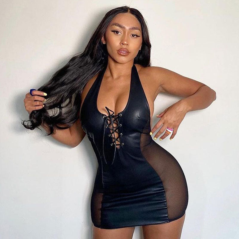 Close-up of a black faux leather and mesh bodycon dress with a halter neckline and lace-up front