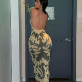 Woman wearing a long-sleeved, open-back, bodycon maxi dress with a green and cream abstract print.