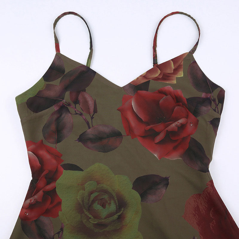 Close-up of a floral print midi slip dress with red and green roses.